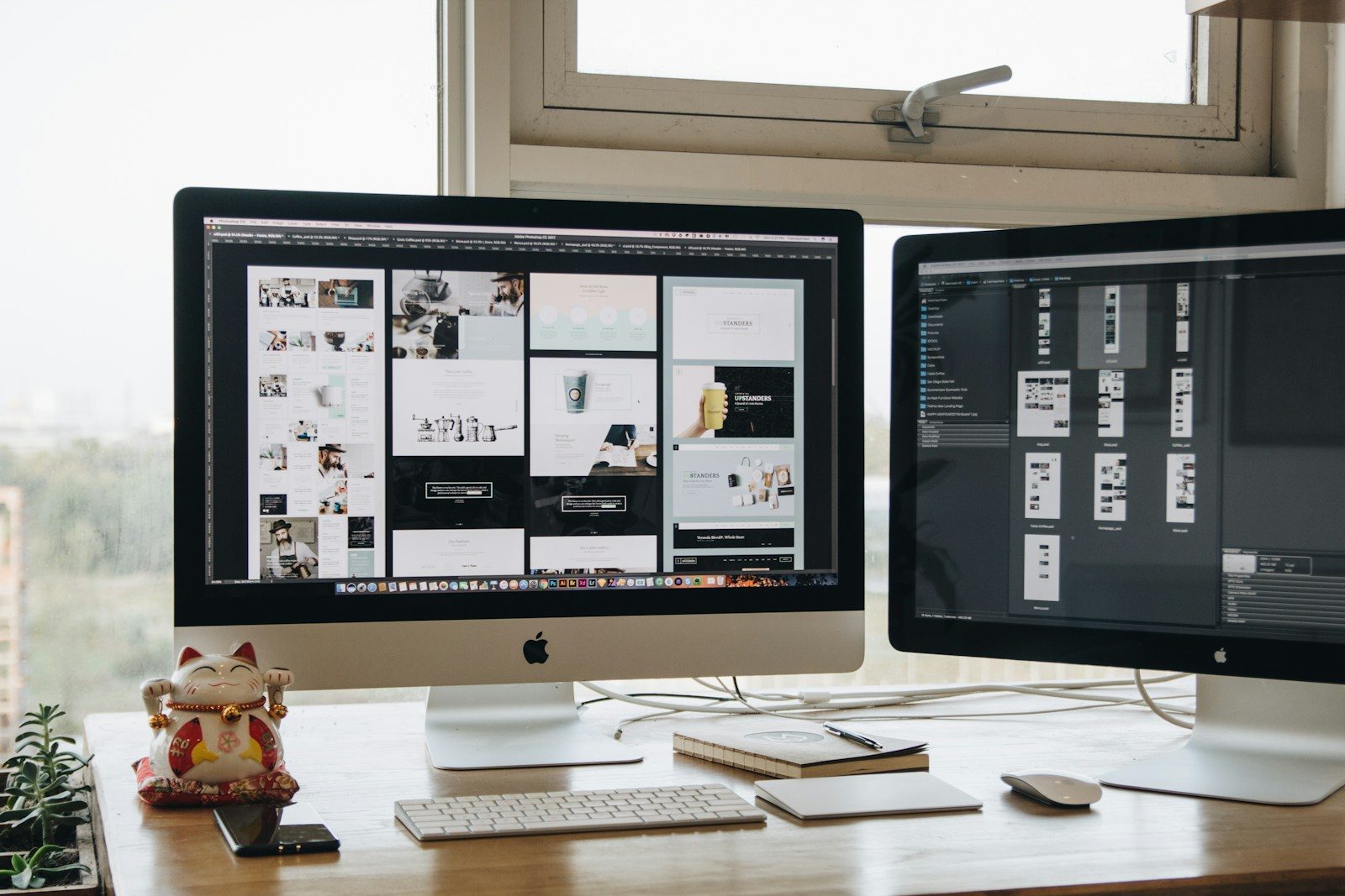 Two monitors setup next to each other on a computer desk